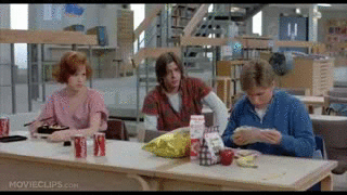 From The Breakfast Club: a popular boy makes a really weird sandwich, eliciting looks from his peers.