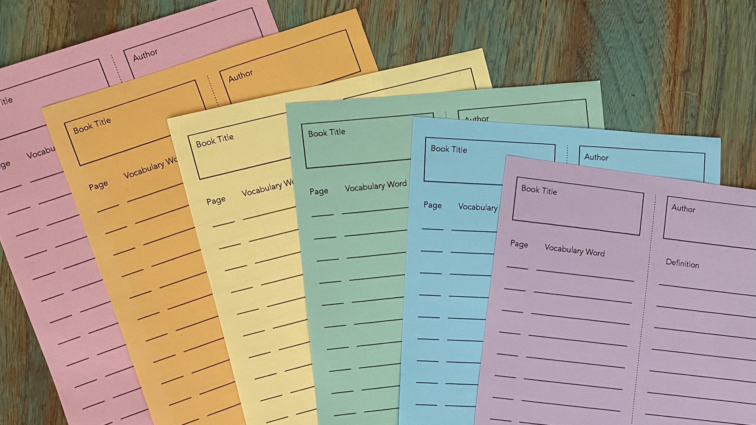 A series of vocabulary list bookmarks printed on rainbow colored paper